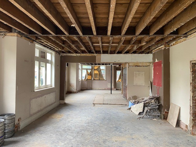 The current interior of the former Inkerman Pub - the walls are bare and the roof rafters showing.