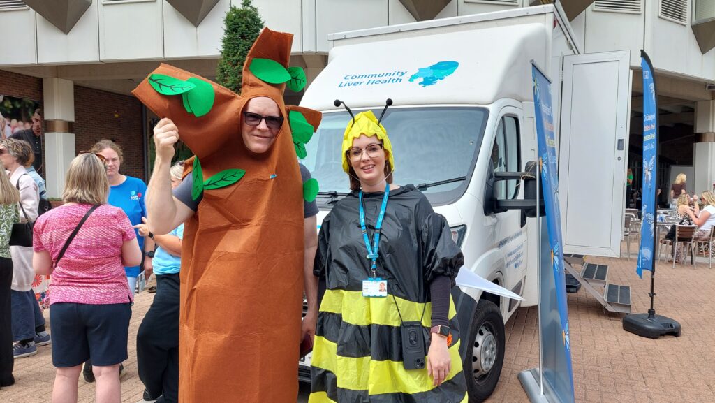 Sustainability Leads from the ICB and West Suffolk NHS Foundation Trust dressed as a tree and a bee