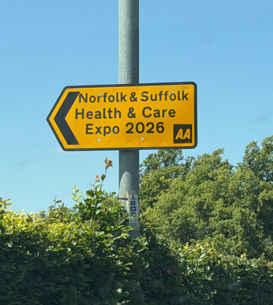 Yellow and black AA sign pointing to Norfolk and Suffolk Health & Care Expo 2026