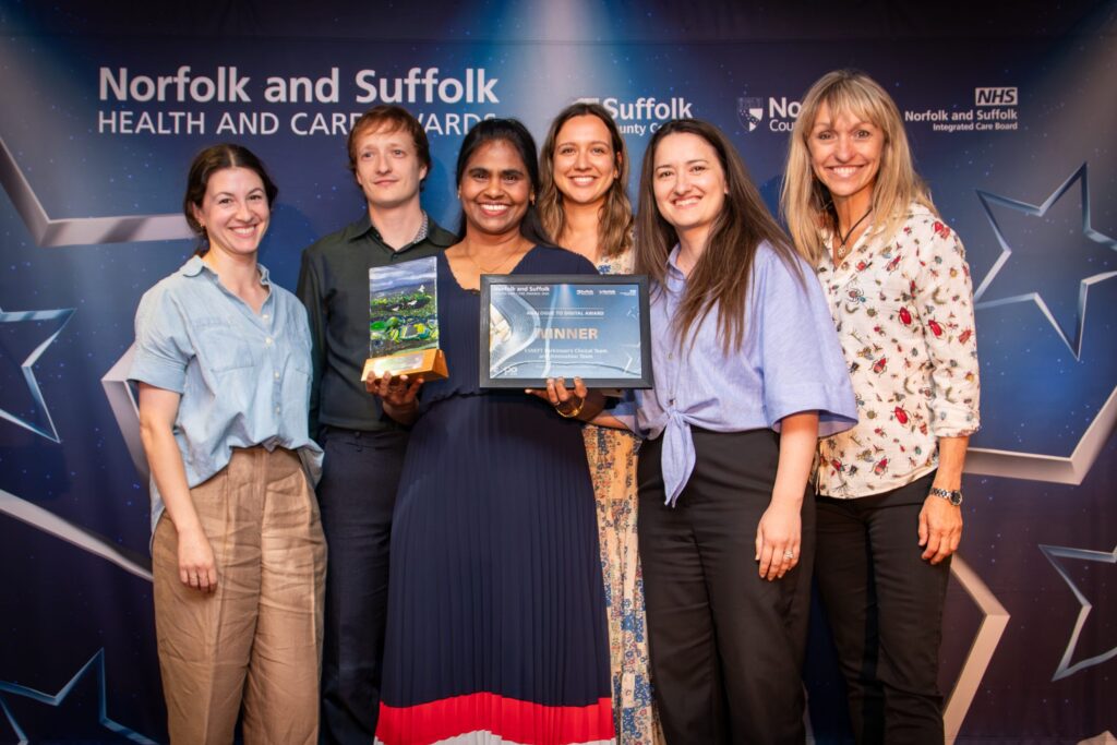 Members of the ESNEFT Parkinson's Team and Innovation Team holding their award and certificate with Michaela Strachan