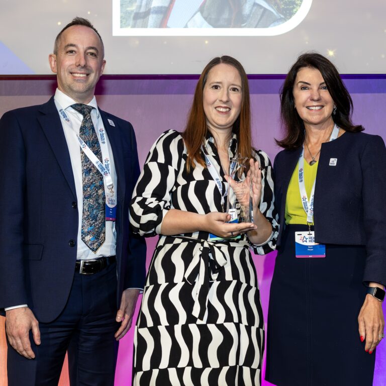 Gemma Longhurst (centre) with managing director of the SFJ (Skills for Health, Skills for Justice) awards David Higham and GP and TV presenter Dawn Harper.
