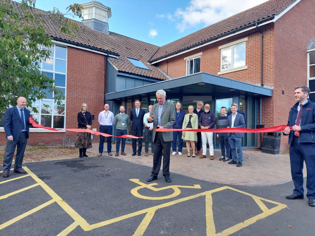 Professor Christopher Hand, Chairman of the Charitable Incorporated Organisation (CIO), cutting the ribbon.