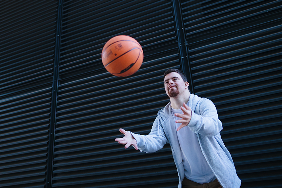 Young man throwing a basketball
